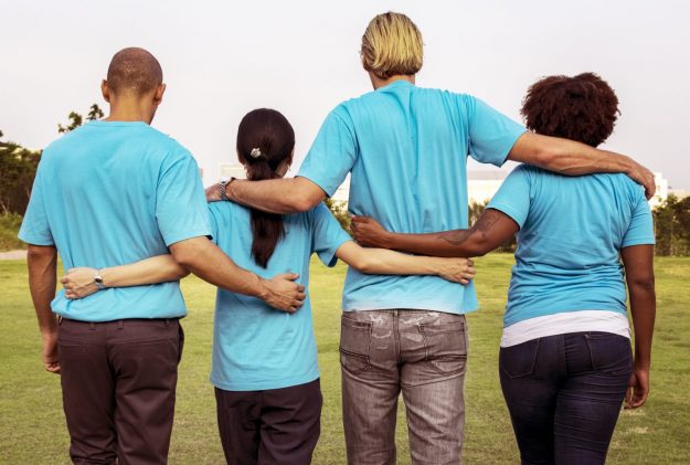 Group of happy and diverse volunteers